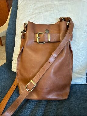 Qisabags - Small Classic Tan Leather Bucket Messenger Bag with Buckle Detail